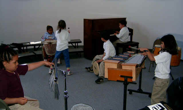 elementary music players - chime player; djembe palyer,  conga player, pianist, metallophone player